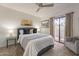 Relaxing main bedroom with neutral tones and a private balcony at 5757 W Eugie Ave # 2081, Glendale, AZ 85304