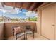 Cozy patio with comfortable chairs and a view, perfect for relaxing and enjoying the outdoors at 5757 W Eugie Ave # 2081, Glendale, AZ 85304