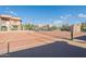 Another view of community tennis courts with residential buildings and covered parking visible at 5757 W Eugie Ave # 2081, Glendale, AZ 85304