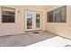 Covered back patio with double doors leading to the backyard at 5867 W Cochise Dr, Glendale, AZ 85302