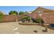 Landscaped backyard showcases a variety of plants, flowers, and stone accents, perfect for relaxing at 5867 W Cochise Dr, Glendale, AZ 85302