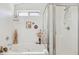 This bright bathroom is equipped with a soaking tub and a glass-enclosed shower at 5867 W Cochise Dr, Glendale, AZ 85302