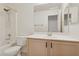 Bathroom featuring a shower over tub, vanity, and neutral decor at 5867 W Cochise Dr, Glendale, AZ 85302