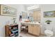The bathroom showcases a vanity area, a toilet, and neutral-toned cabinets at 5867 W Cochise Dr, Glendale, AZ 85302