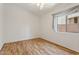 Bright bedroom with wood floors, natural light and neutral tones at 5867 W Cochise Dr, Glendale, AZ 85302