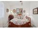 This bedroom has a floral quilt on the bed with coordinated decor and artwork at 5867 W Cochise Dr, Glendale, AZ 85302