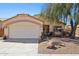 Charming single-story home with a two-car garage and xeriscaped front yard at 5867 W Cochise Dr, Glendale, AZ 85302