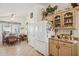 Open kitchen with ample storage, natural light, and adjacent dining area at 5867 W Cochise Dr, Glendale, AZ 85302