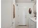 Bright laundry room features a washer, dryer, storage cabinets, and access to the exterior at 5867 W Cochise Dr, Glendale, AZ 85302