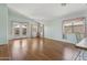 Bright living room boasts wood floors, ample natural light, and backyard access at 5867 W Cochise Dr, Glendale, AZ 85302
