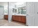 Bathroom featuring double sinks, a large mirror, and good lighting at 6618 S 54Th Ln, Laveen, AZ 85339