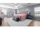 The large bedroom boasts ample natural light and neutral gray color pallet at 6618 S 54Th Ln, Laveen, AZ 85339