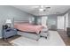 Spacious bedroom features a ceiling fan, and a sitting area with neutral color pallet at 6618 S 54Th Ln, Laveen, AZ 85339