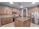 Spacious kitchen featuring ample cabinet space, granite counters, and stainless steel appliances at 6618 S 54Th Ln, Laveen, AZ 85339