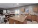 Bright kitchen featuring granite countertops, an island, and stainless steel appliances at 6618 S 54Th Ln, Laveen, AZ 85339
