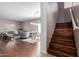 Open-concept view showcasing the staircase, living area, and dining space at 6618 S 54Th Ln, Laveen, AZ 85339