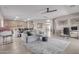 Open-concept living area features tile floors, and access to the kitchen at 6618 S 54Th Ln, Laveen, AZ 85339