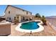 Inviting backyard with a private pool, covered patio, and lush landscaping, perfect for entertaining at 6618 S 54Th Ln, Laveen, AZ 85339