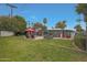 Large backyard with a pool, comfortable seating, built-in grill, and ample green space for outdoor enjoyment at 6746 E Monterosa St, Scottsdale, AZ 85251