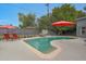 Inviting backyard featuring a pool with seating, an outdoor dining area, and a serene garden at 6746 E Monterosa St, Scottsdale, AZ 85251