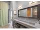 Stylish bathroom featuring a concrete double vanity, large mirror, and neutral color scheme at 6746 E Monterosa St, Scottsdale, AZ 85251