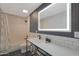 Modern bathroom with subway tile, an illuminated mirror, and sleek vanity at 6746 E Monterosa St, Scottsdale, AZ 85251