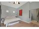 Well-lit bedroom featuring neutral paint, light hardwood floors, a ceiling fan, and an area rug at 6746 E Monterosa St, Scottsdale, AZ 85251