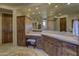Well-lit bathroom featuring a vanity with a sink and storage and a decorative rug at 7373 E Clubhouse Dr # 24, Scottsdale, AZ 85266