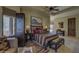 Bedroom showcasing a king bed, a leather bench, and decorative rugs on tile floors at 7373 E Clubhouse Dr # 24, Scottsdale, AZ 85266
