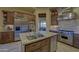 Gourmet kitchen with stainless steel appliances, granite countertops, and custom wood cabinetry offering ample storage at 7373 E Clubhouse Dr # 24, Scottsdale, AZ 85266