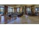 Open concept living room and dining area with hardwood floors and expansive windows showcasing the outdoor view at 7373 E Clubhouse Dr # 24, Scottsdale, AZ 85266