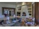 Living room features a fireplace, built-in shelving, hardwood floors, and comfortable seating perfect for entertaining at 7373 E Clubhouse Dr # 24, Scottsdale, AZ 85266
