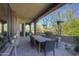 Covered patio with dining set, BBQ and desert landscaping at 7373 E Clubhouse Dr # 24, Scottsdale, AZ 85266