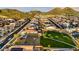 Birds eye view of Aloravita featuring its community park, playground, sidewalks and mountain views at 7422 W Buckhorn Trl, Peoria, AZ 85383