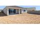 Unlandscaped backyard featuring dirt, a covered patio, and block wall at 7422 W Buckhorn Trl, Peoria, AZ 85383