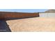 Unlandscaped backyard featuring dirt and block wall at 7422 W Buckhorn Trl, Peoria, AZ 85383