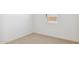 Bedroom boasts neutral carpet, a bright window, and ample natural light at 7422 W Buckhorn Trl, Peoria, AZ 85383