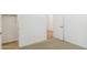 Bedroom showcases neutral carpet, with the door to a closet on the left at 7422 W Buckhorn Trl, Peoria, AZ 85383