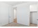 Neutral carpet, a closet and access to the bathroom are the highlights of this room at 7422 W Buckhorn Trl, Peoria, AZ 85383