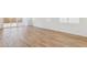 Bright and airy living room featuring stylish wood-look floors and large windows for ample natural light at 7422 W Buckhorn Trl, Peoria, AZ 85383