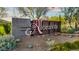Elegant community sign for Aloravita, set amidst desert landscaping and lush greenery at 7422 W Buckhorn Trl, Peoria, AZ 85383