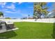 Large grassy backyard, with concrete patio, ideal for outdoor entertaining at 7526 E Drummer Ave, Mesa, AZ 85208