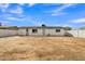 Dirt backyard, with lots of potential, showing the back of the property at 7526 E Drummer Ave, Mesa, AZ 85208