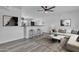 Open-concept living space with breakfast bar, modern furnishings, and recessed lighting at 7526 E Drummer Ave, Mesa, AZ 85208