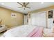 Bedroom featuring neutral colors, a ceiling fan, closet, shelving, and light colored area rug at 7725 N Via De Fonda --, Scottsdale, AZ 85258