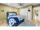 This bedroom features a plush blue area rug, closet, built in shelving, and a bed with blue accents at 7725 N Via De Fonda --, Scottsdale, AZ 85258
