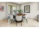 Well-lit dining room with modern chairs, a round table and access to outdoor space at 7725 N Via De Fonda --, Scottsdale, AZ 85258