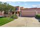 Charming single-story home with lush lawn, mature tree, and two-car garage in daylight at 7725 N Via De Fonda --, Scottsdale, AZ 85258