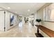 Bright foyer features travertine floors, recessed lighting, and views into the living room with a fireplace at 7725 N Via De Fonda --, Scottsdale, AZ 85258