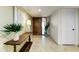 Inviting hallway featuring tile floors, wooden table and a decorative plant at 7725 N Via De Fonda --, Scottsdale, AZ 85258